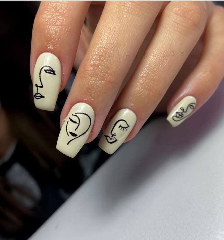 Abstract face silhouette nails with artistic lines by nailbeautyguide
