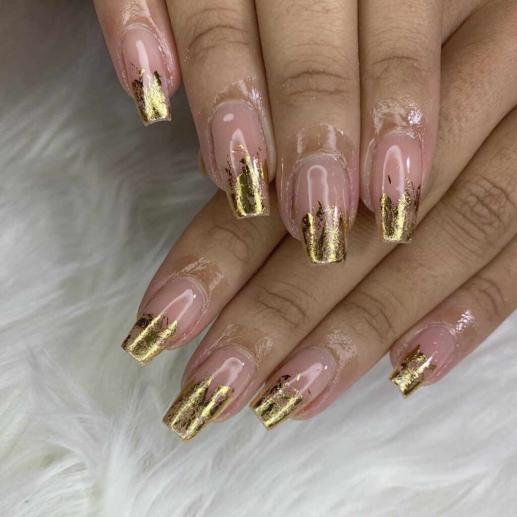 Beige base with random gold foil shapes by nails__bytoni_888