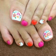 Close-up shot highlighting different toe nail textures with dramatic lighting showing dimensional contrasts. by nailbeautyguide
