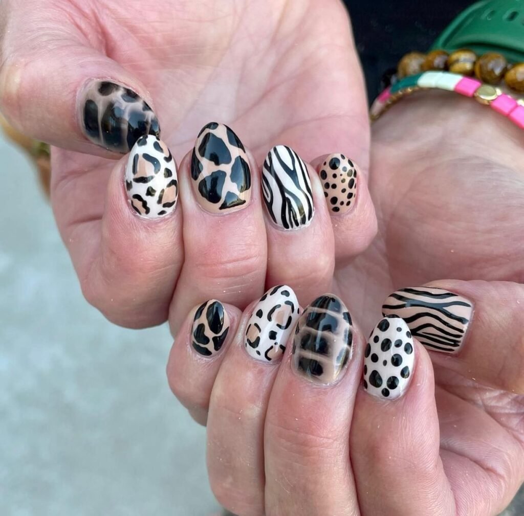 Cow spots mixed with leopard print and bright colors by nailitmedia