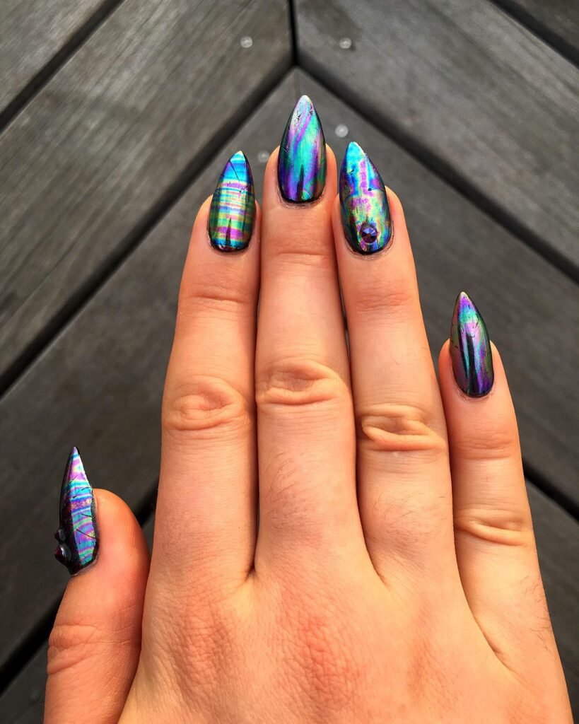 Dark base with rainbow iridescent overlay by turned_up_talons