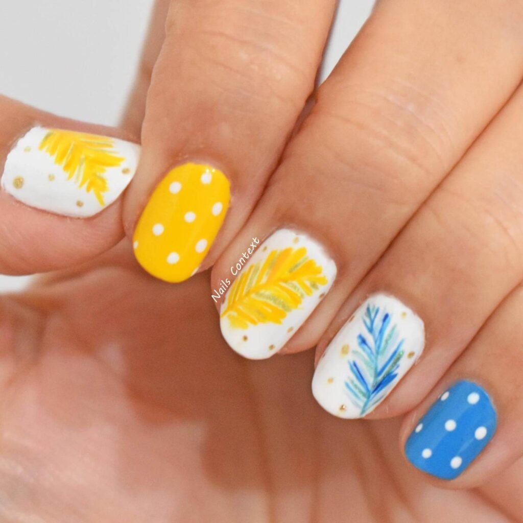  Feather pattern nails with yellow canary theme by nailscontext