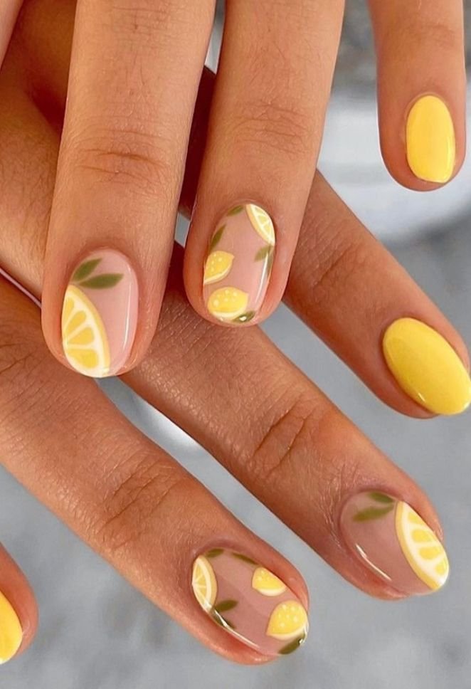 Lemon yellow nails with citrus nail art by nailbeautyguide