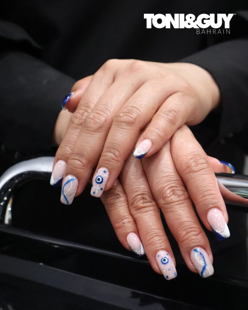 Nude background with evil eye designs and flowing lines by toniandguybahrain