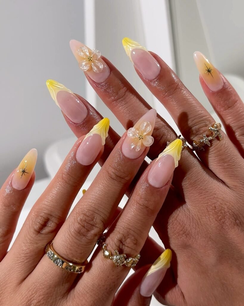 Pastel yellow nails with white daisy accents by pearliepressed