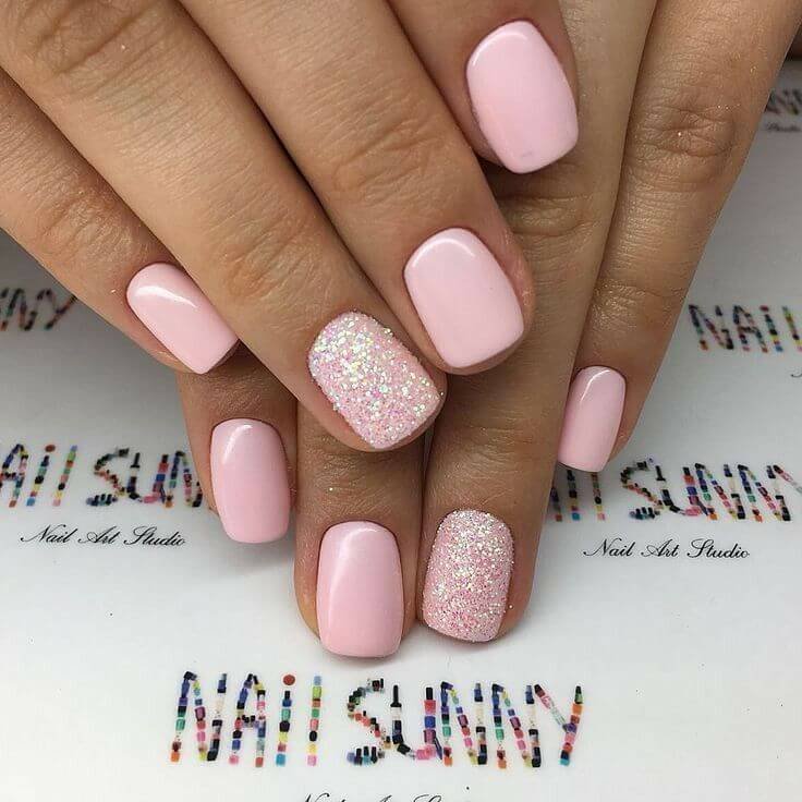 Pink nails with glitter on one nail by nailbeautyguide