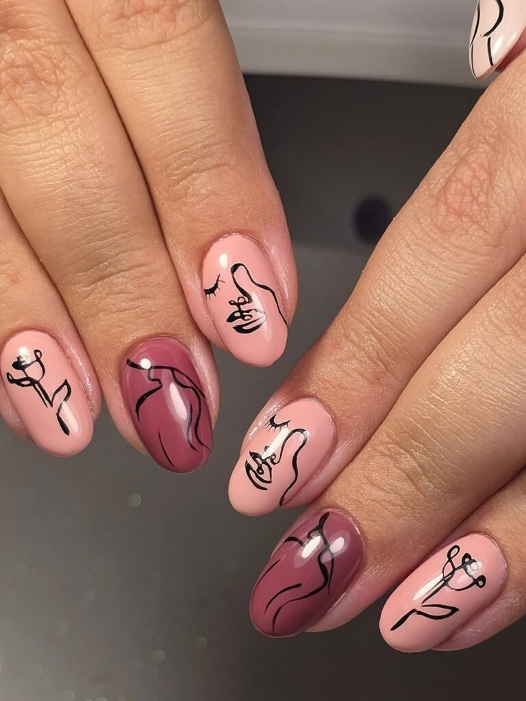 Soft pink nails featuring abstract human silhouettes by _nails.in.bloom