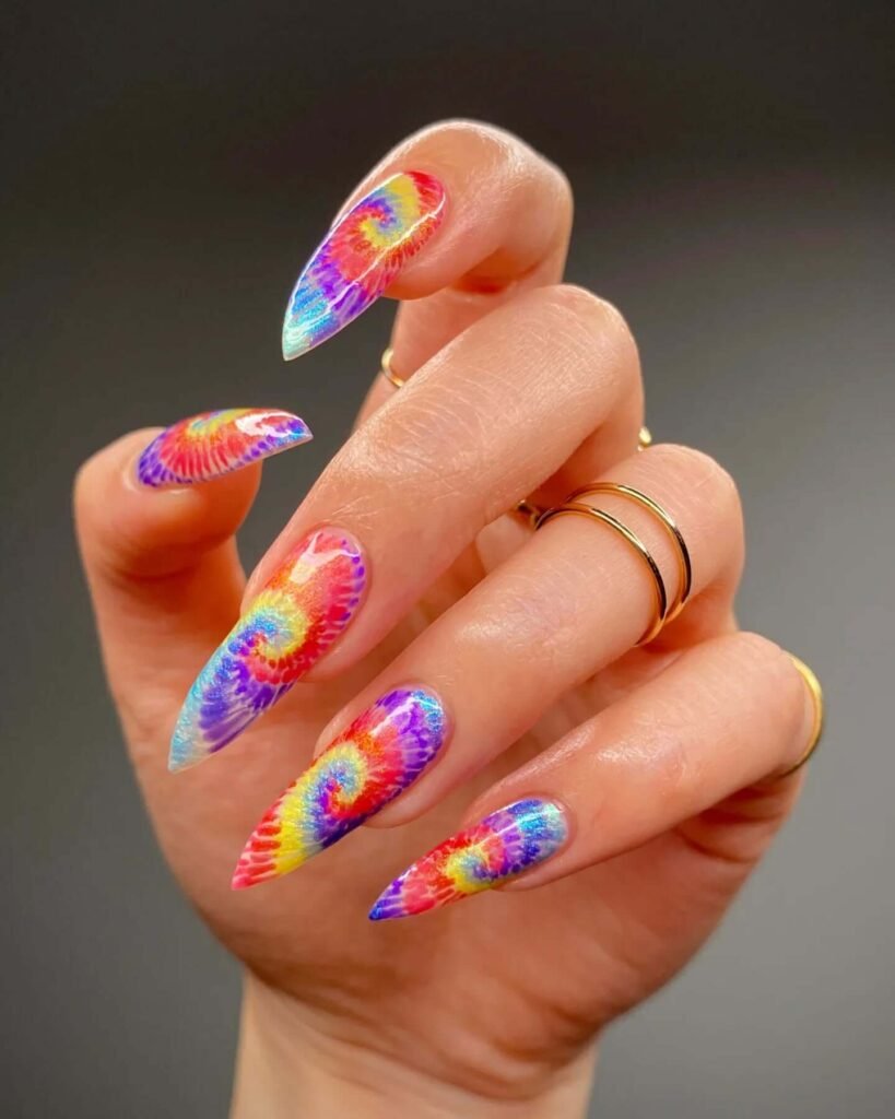 Tie-dye spiral nails with rainbow colors by allisondoesnails