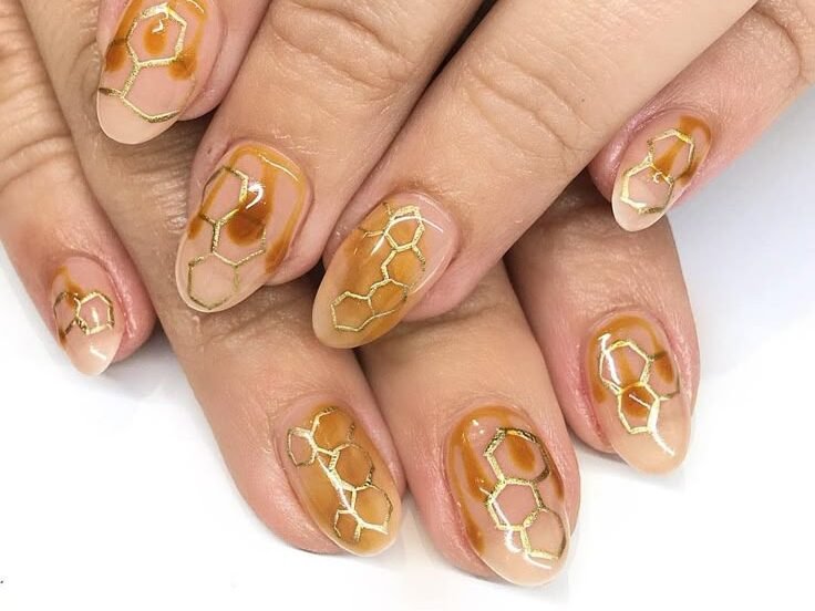 Warm honey yellow nails with natural lighting by nailbeautyguide