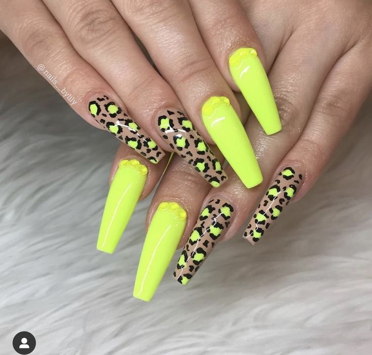 Yellow base with black leopard print pattern by nailbeautyguide