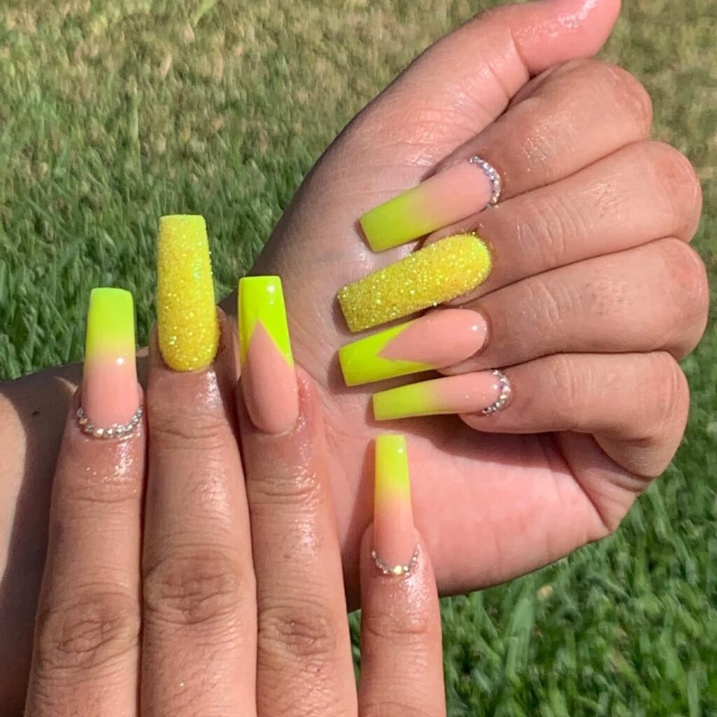 Yellow nails with gold glitter tips by nailss.by.lucyy