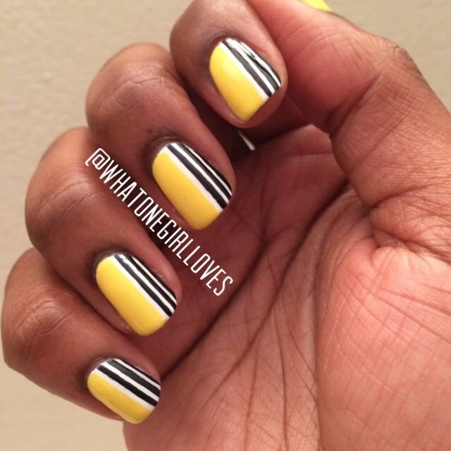 Yellow nails with thin white and black stripes by nailbeautyguide