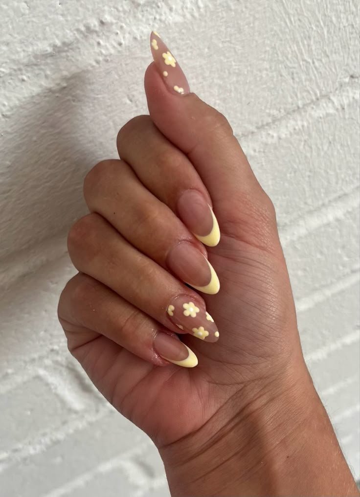 Yellow negative space nail art with clear sections by nailbeautyguide