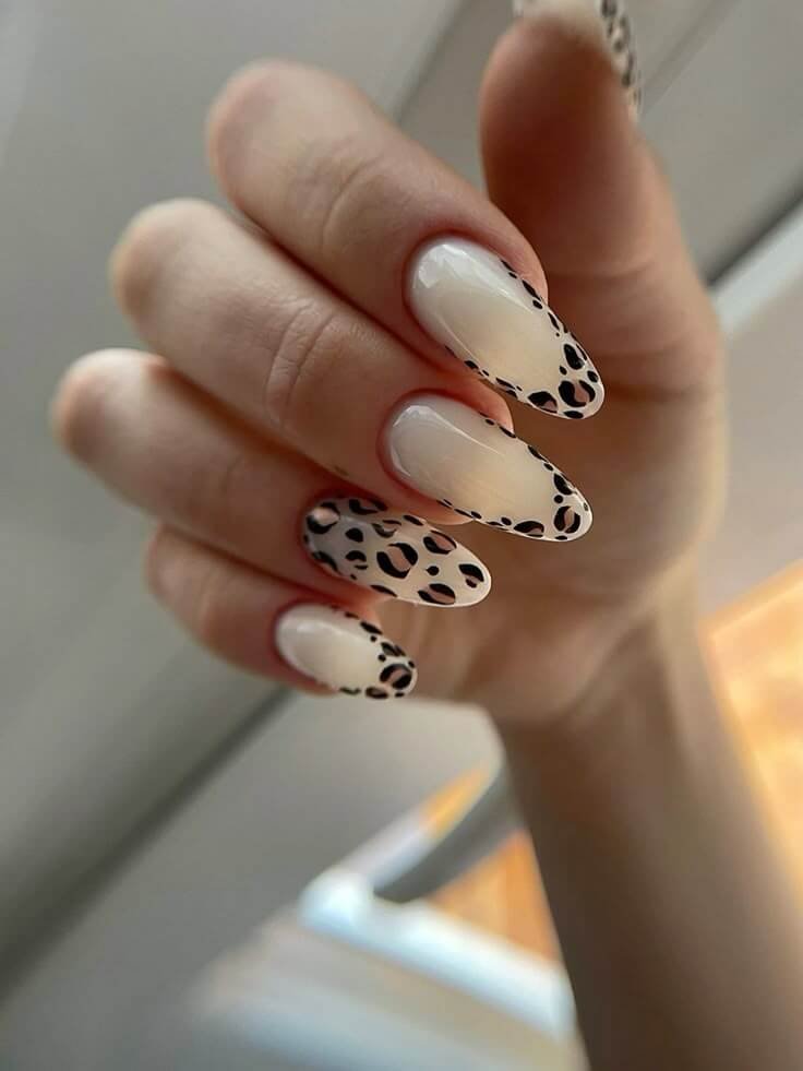 Zebra stripes painted in black over a glossy white base by nailbeautyguide