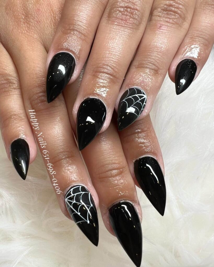 Black nails with white spider web accent by happynails55105