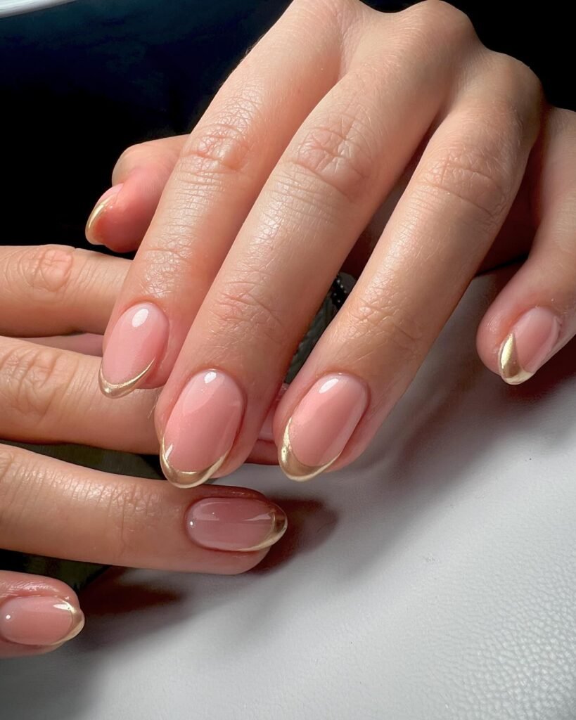 Chrome French tips styled with futuristic props by francesca_sykes_nail_artist_
