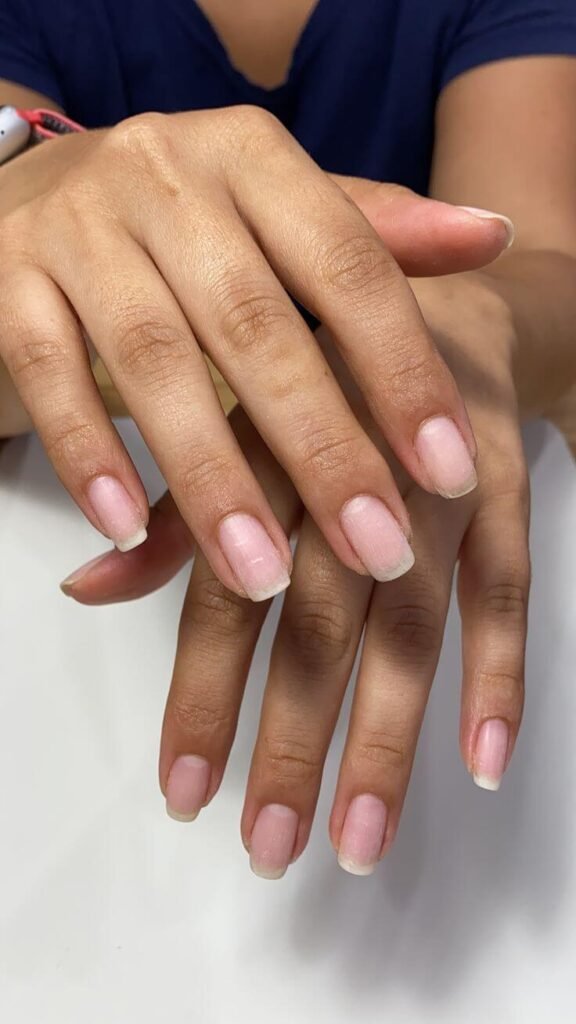 Close-up of natural, shiny nails on well-moisturized hands by nailbeautyguide