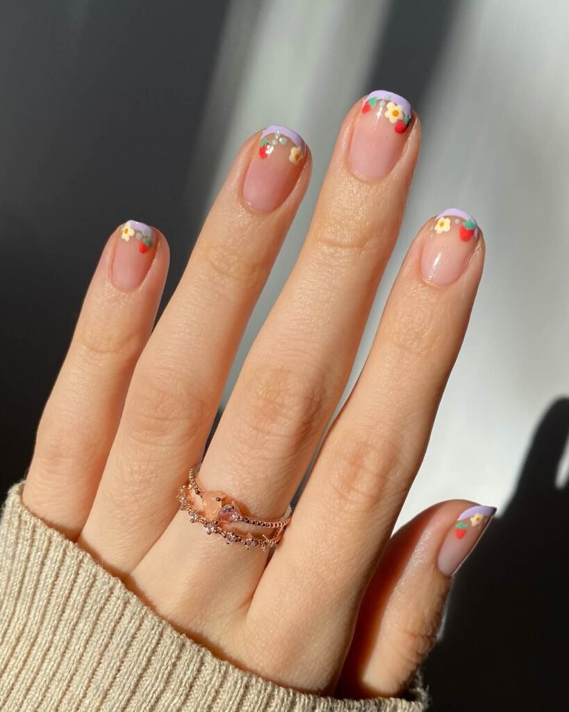 Delicate floral French tips styled with fresh flowers by polished_yogi