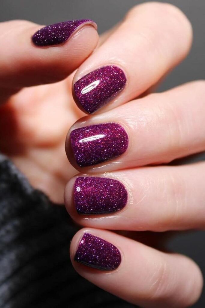 Dusty plum gel nails with micro-glitter accent by nailbeautyguide