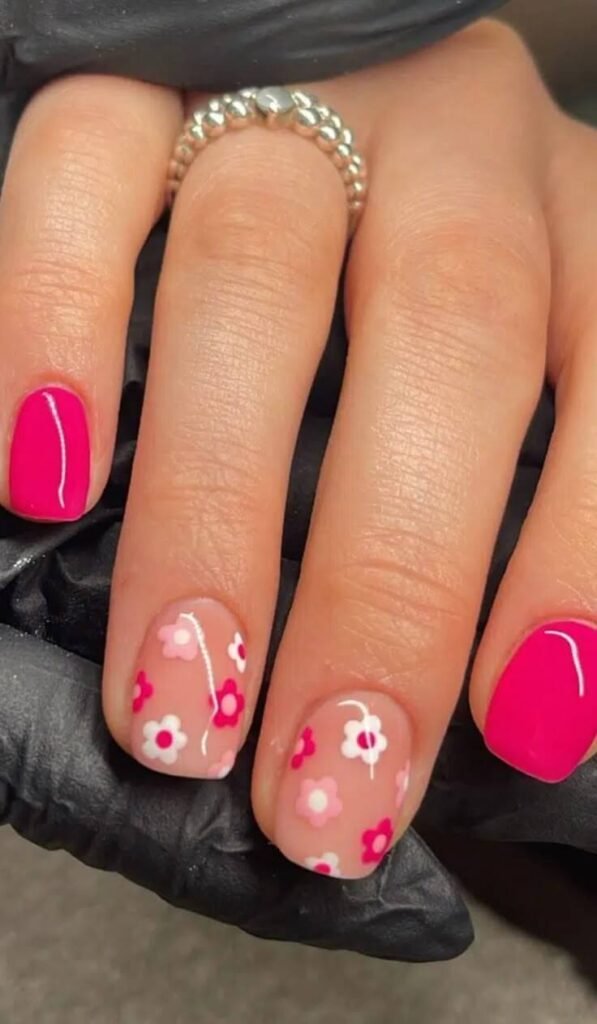 Floral neon pink nail styled with fresh flowers. by nailbeautyguide