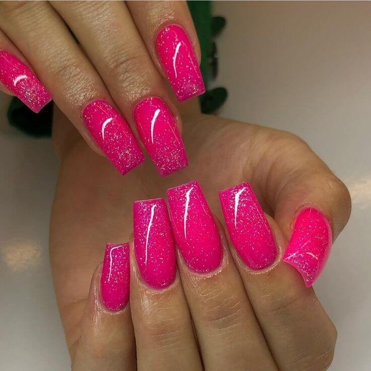 Glitter nails styled with disco-themed props. by nailbeautyguide