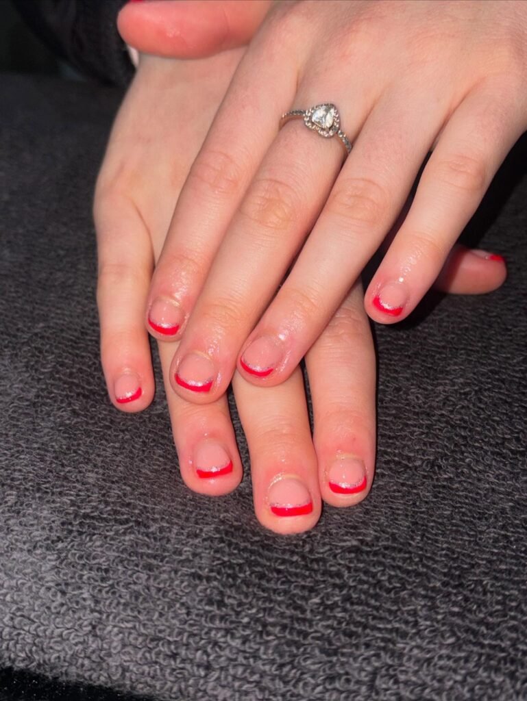 Glitter star French tips styled with celestial props by beauty_byrhian