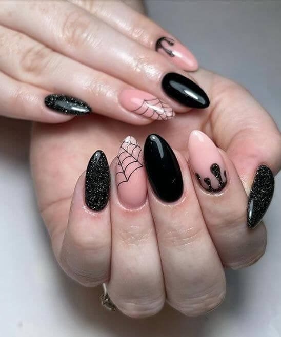 Glossy black October nails with a sleek, bold finish by nailbeautyguide