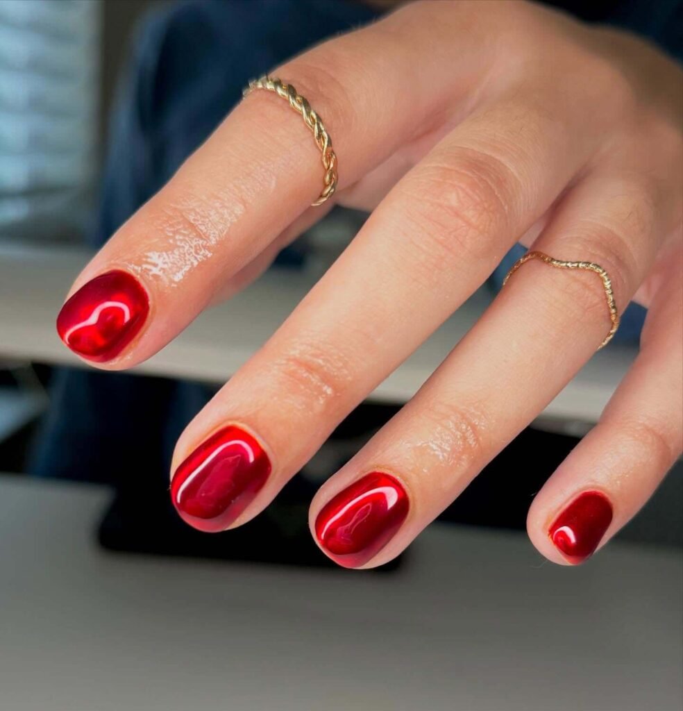 Glossy red candy apple Halloween nails  by creationsbyamsi
