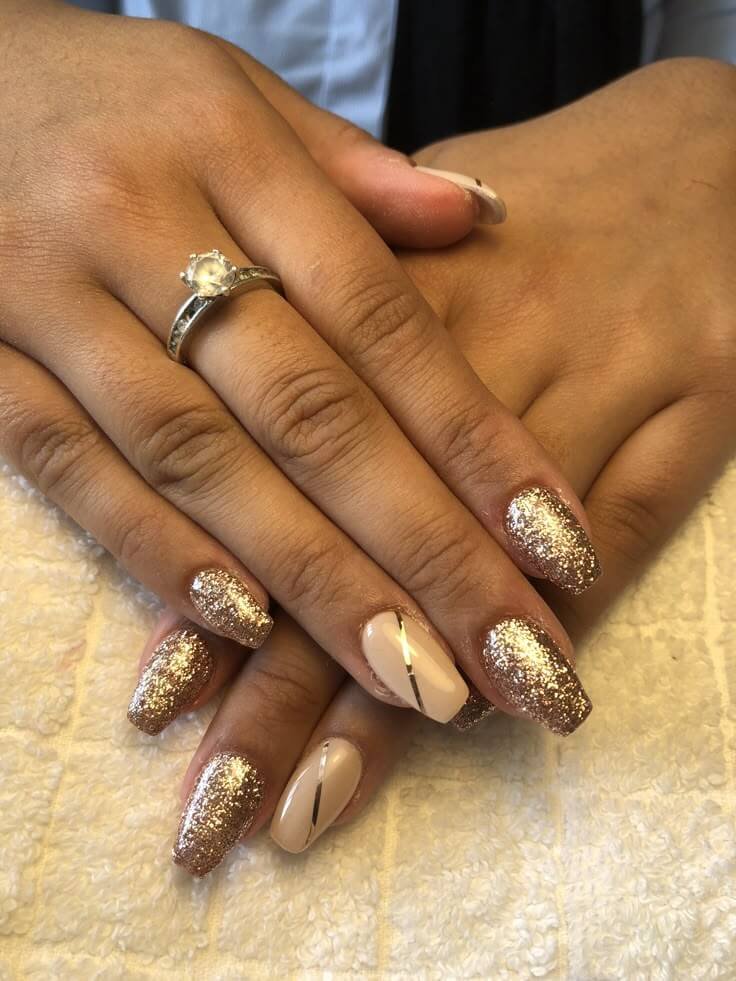 Gold glitter accent over a deep base by nailbeautyguide