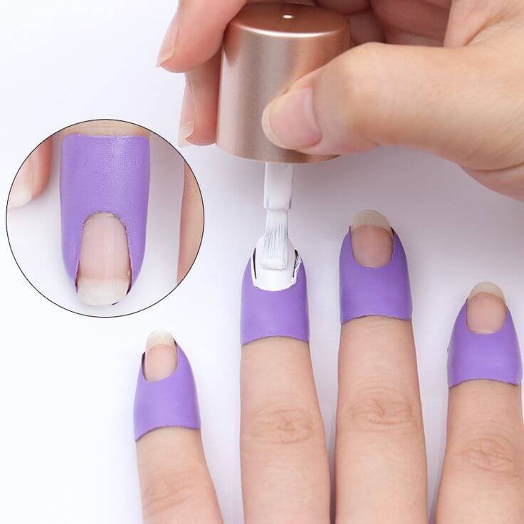 Hands with yellow gloves washing dishes by nailbeautyguide