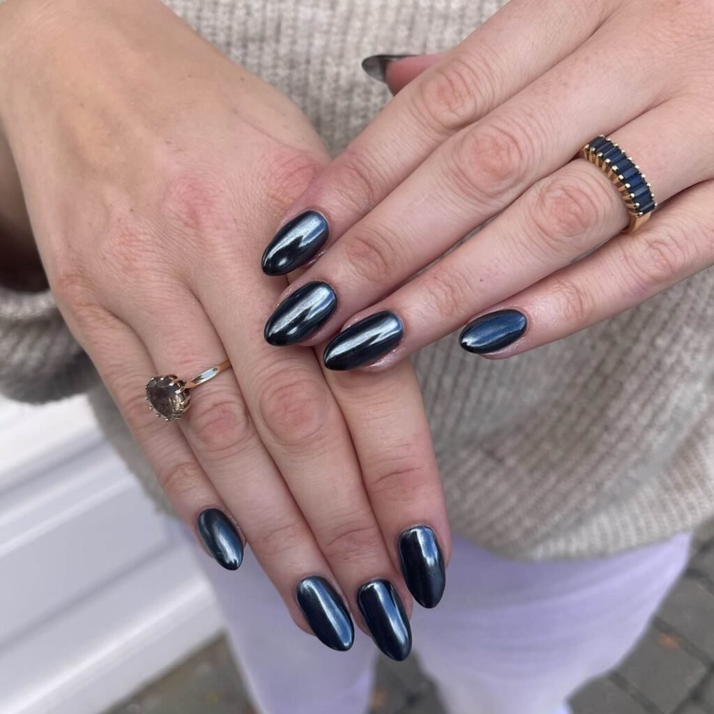 High-shine jet black chrome nail finish by pinkoflondon
