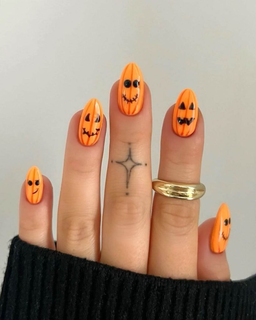 Jelly pumpkin confetti nails by charlotteellennails