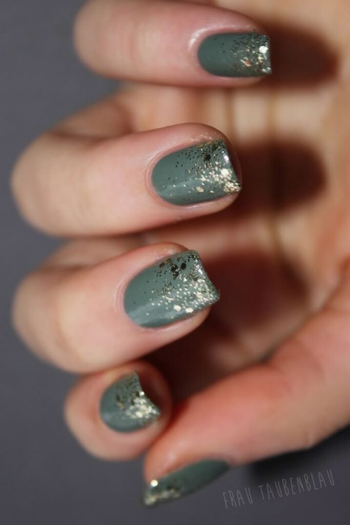 Matte sage nails topped with irregular gold foil accents by nailbeautyguide
