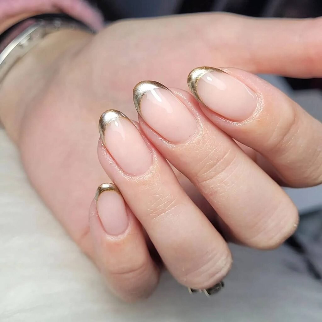 Metallic French tips paired with a sleek black dress by kikilondonnailgel