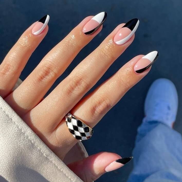 Nude base with uneven black lines and accents by _thenailsworld