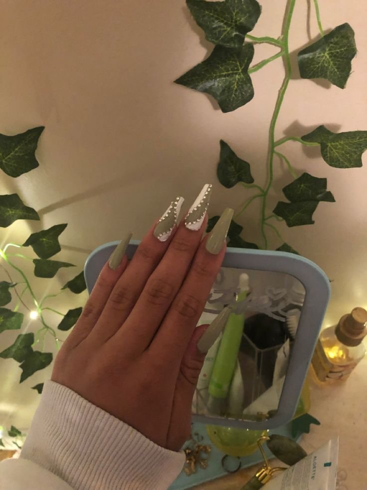 Sage nails with tiny rhinestones placed near cuticles by nailbeautyguide