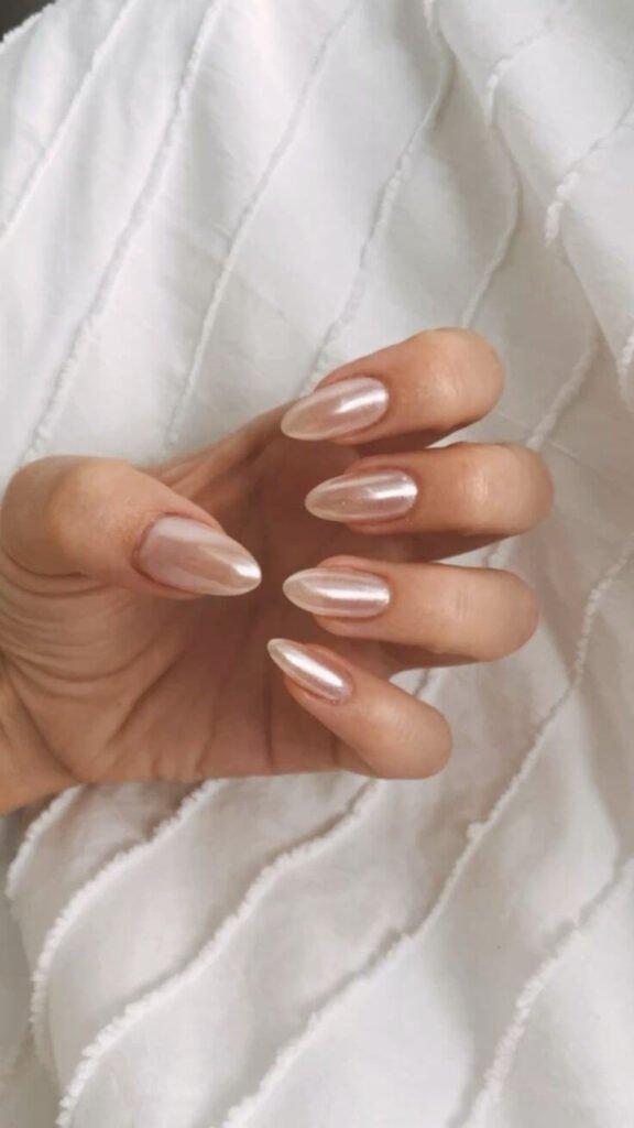 Sheer gel mani with pearl accents by nailbeautyguide