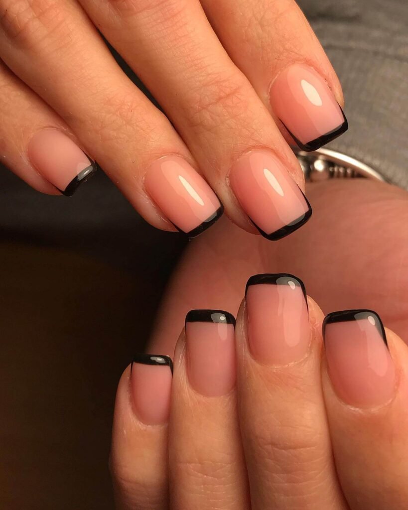 Square nails with sharp black geometric patterns by alessiaaa.c