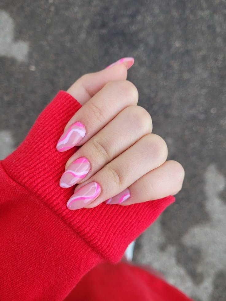 Swirl nails styled with colorful candy props by nailbeautyguide