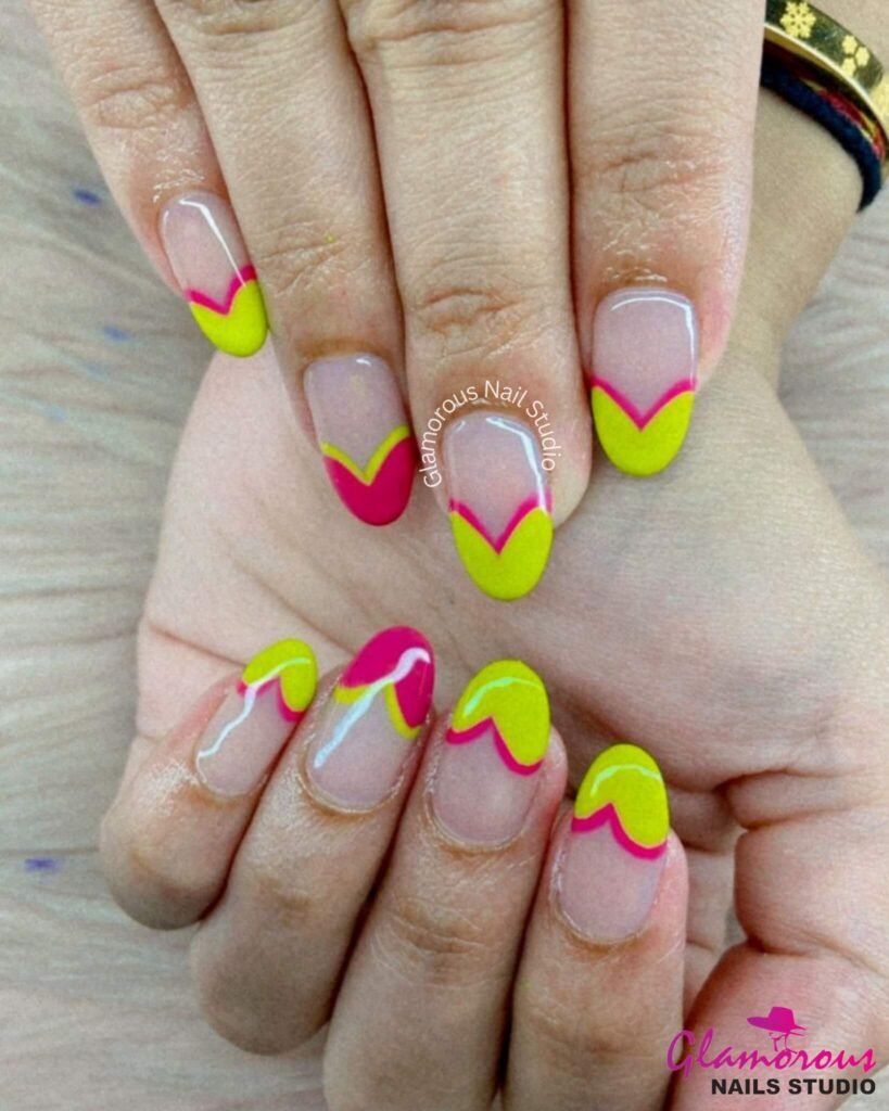 Two-toned nails photographed with bright summer accessories like sunglasses by glamorousnailsstudio
