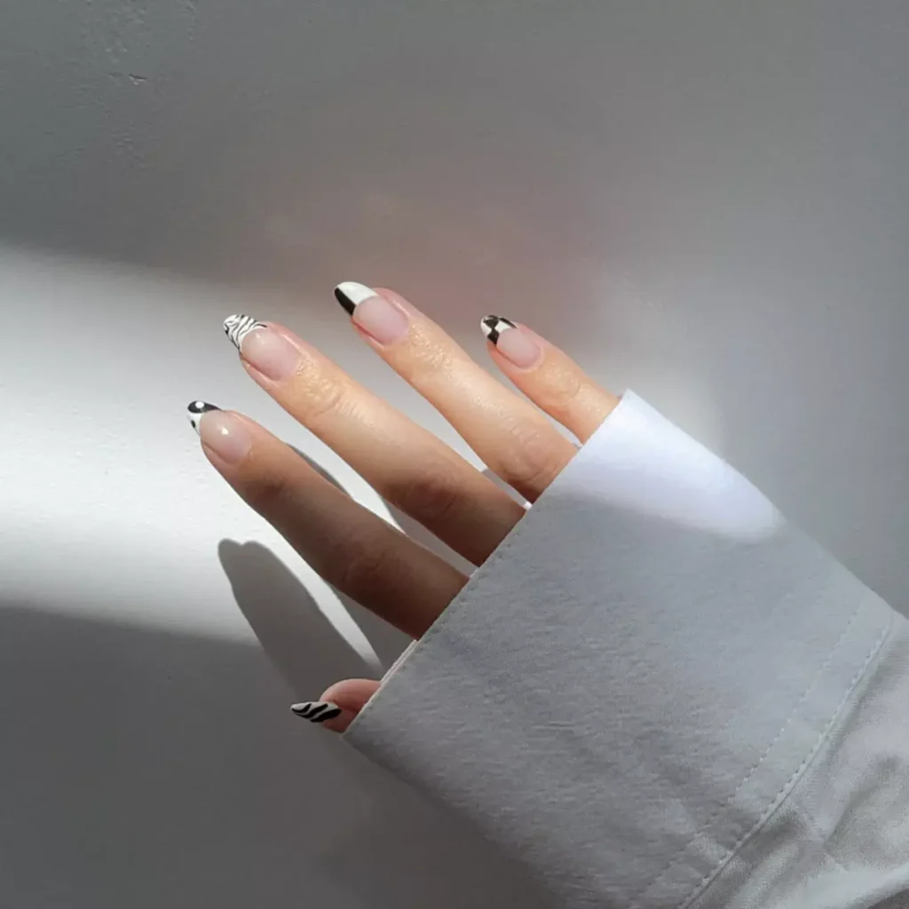Black and white French tip nail design by nailtherapy.co
