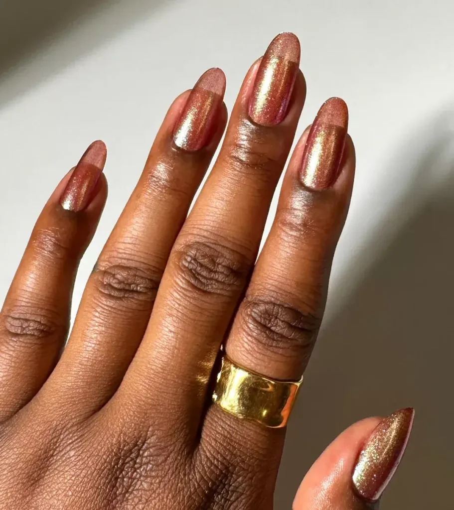 Bronze shimmer thermal nail polish shifting with temperature. by lightslacquer