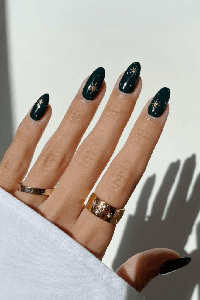 Dark Forest Green Nails with Bold Gold Chrome Stars by phoebesummernails