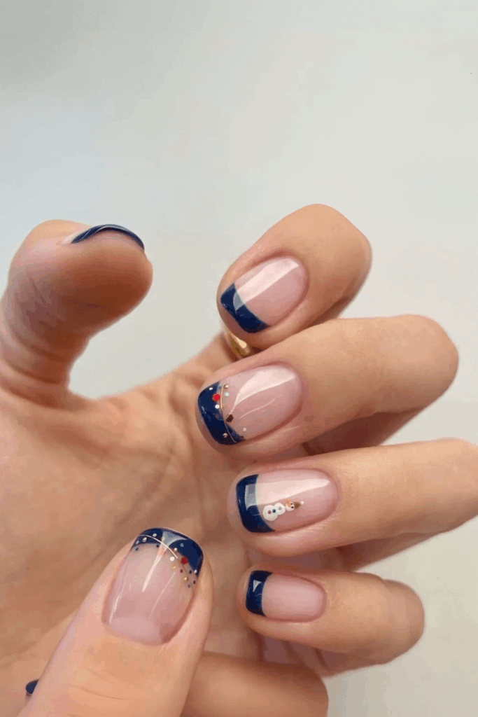 Deep Navy French Tips with Subtle Gold Holiday Accents by nailalamode