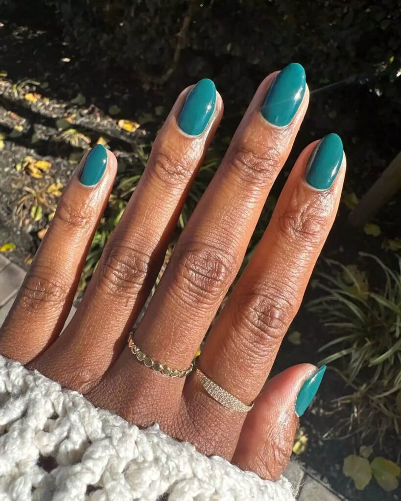 Nails painted with a bold, beautiful trusty turquoise jewel-toned color by lolo.nailedit