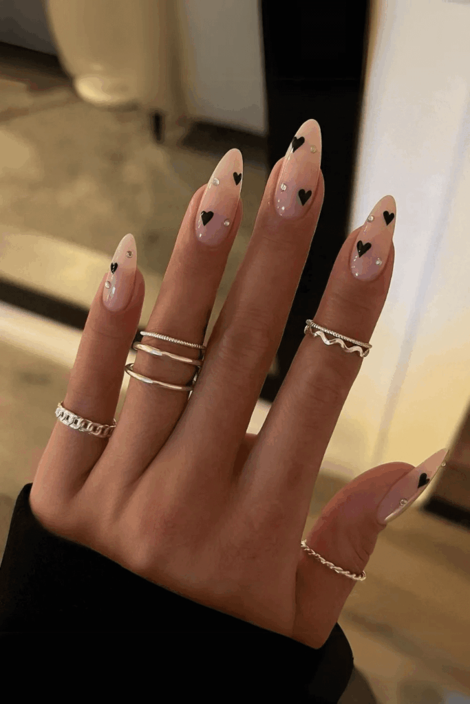Nude Nails with Small Black Hearts and Tiny Rhinestones by nailbeautyguide