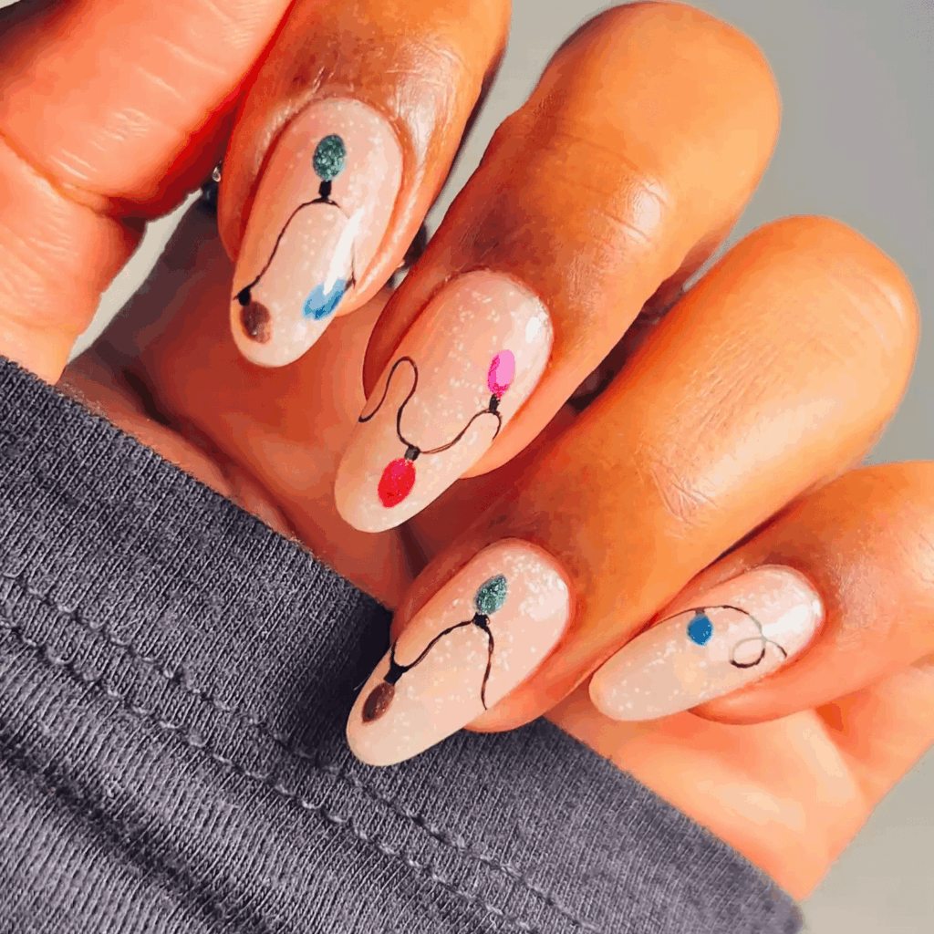 Nude Shimmery Nails with Hand-Painted Christmas Light Art by brushedbyb_