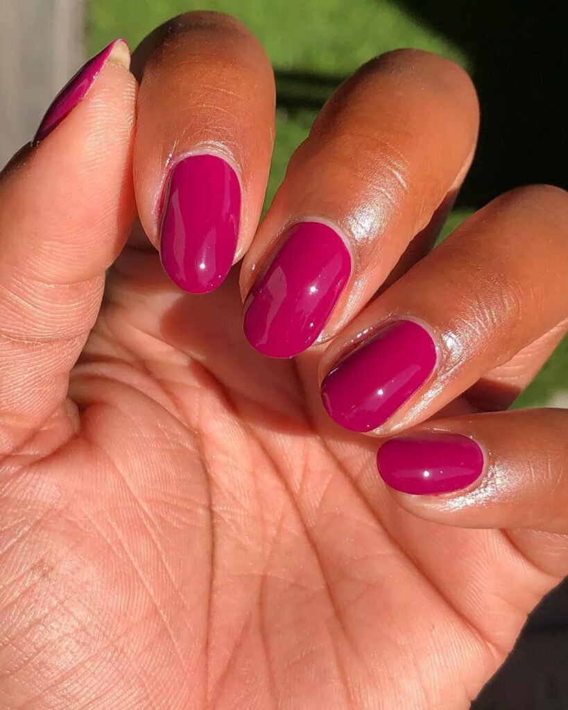 Short nails painted with a deep, vivid magic magenta or raspberry color by chocolategirlmani