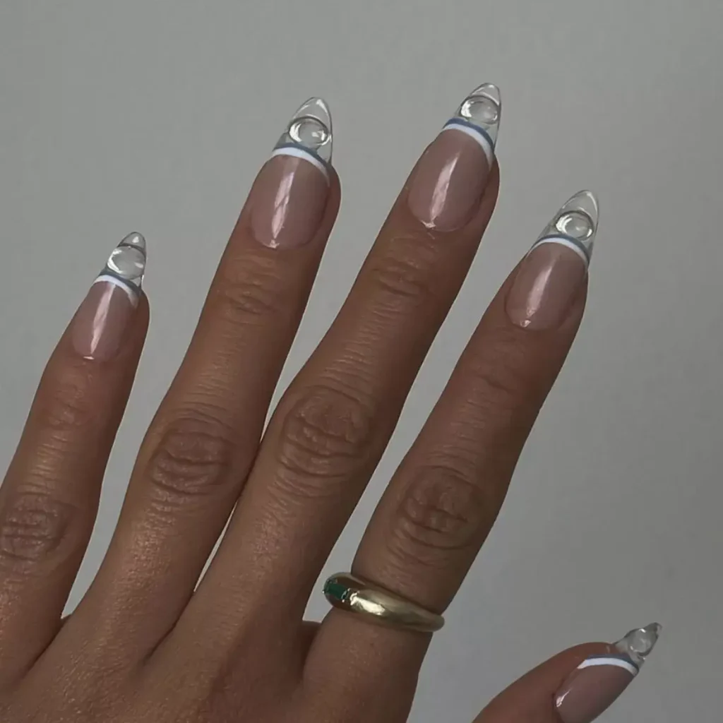 White French tip nails with bubble dot accents by sojinails
