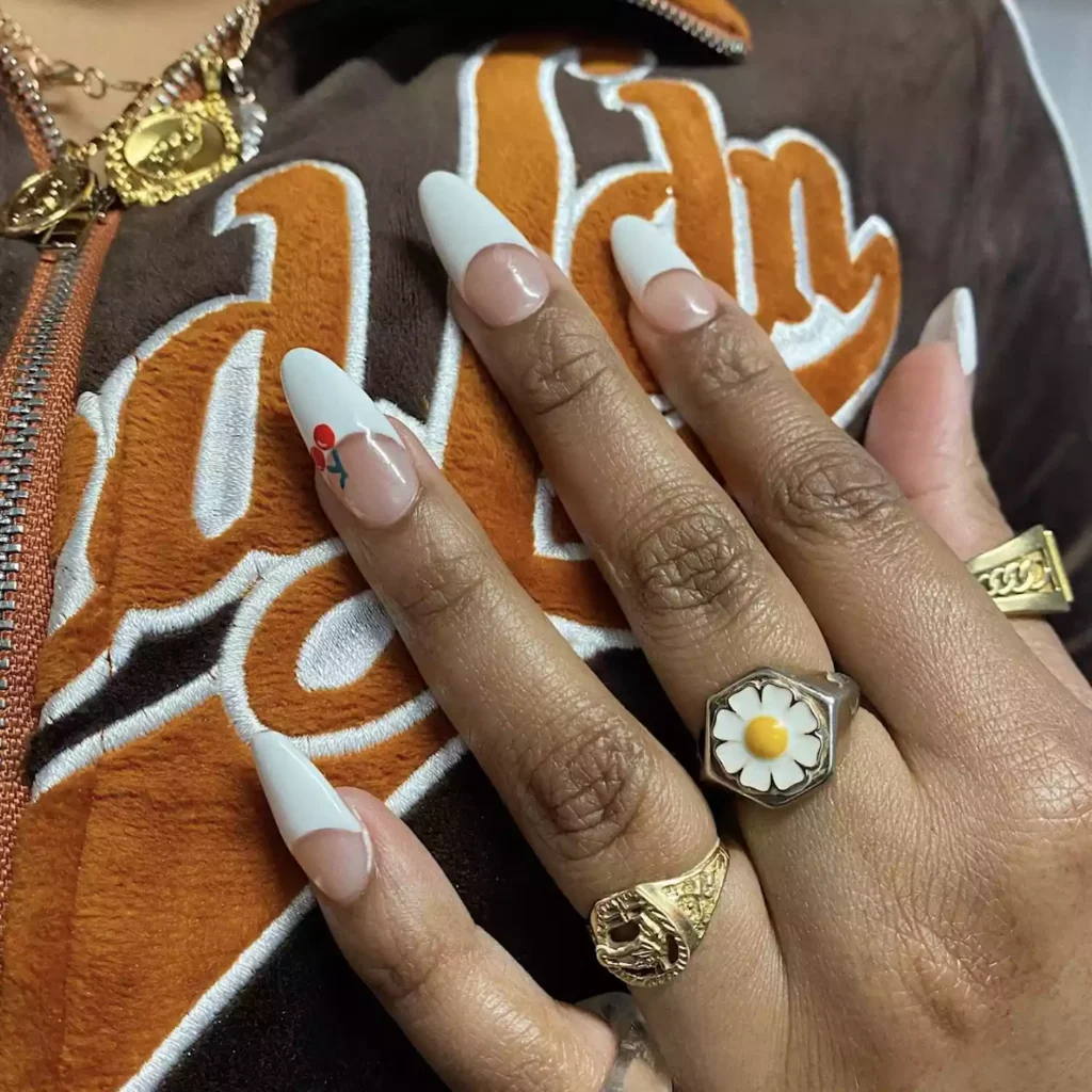White French tip nails with cherry accent by angelsnailz